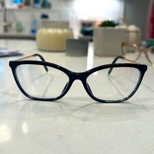 Tiffany & Co frames. Black with gold arms.